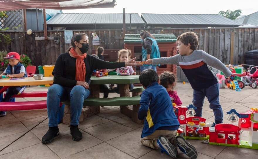 Patricia Moran plays with the children enrolled in her at-home daycare in San Jose on Nov. 2, 2022.
