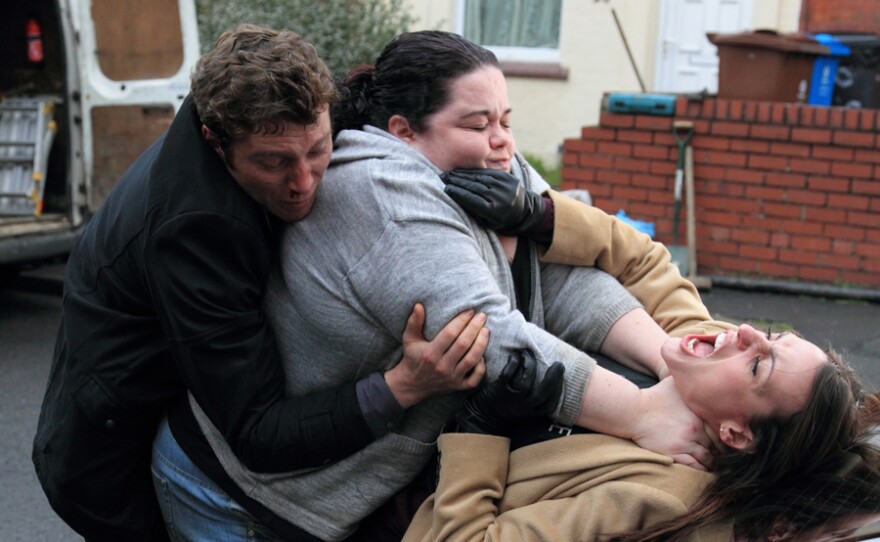 DC Kevin Lumb tries to save Rachel from being strangled by Nadia (Lisa Riley).