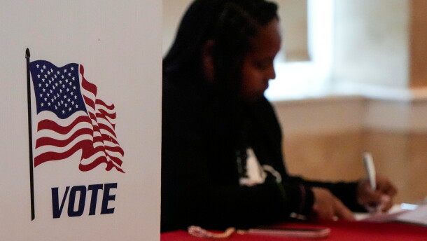 A Fulton County, Ga. staff member works as people vote in a runoff election in Atlanta on June 16, 2026.