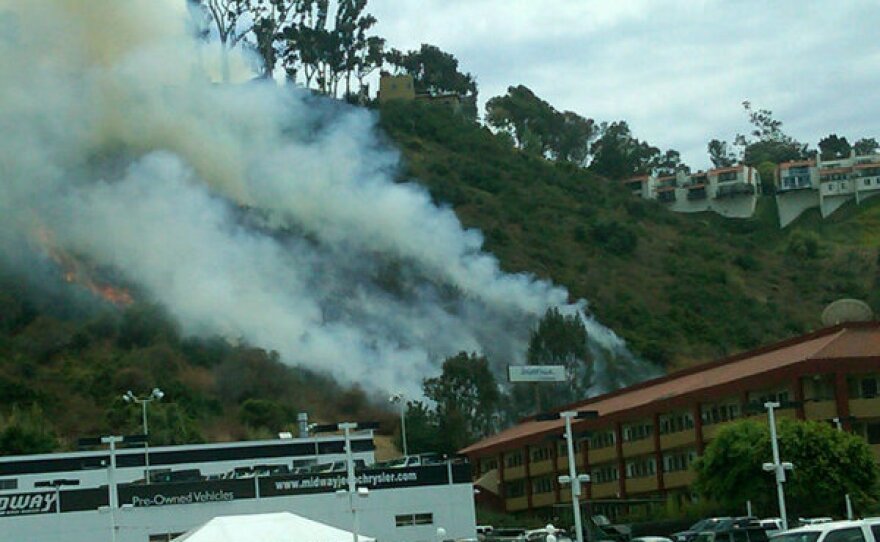A brush fire broke out Thursday, July 15, 2010 in Mission Valley on the south side of Interstate 8 in San Diego, CA.