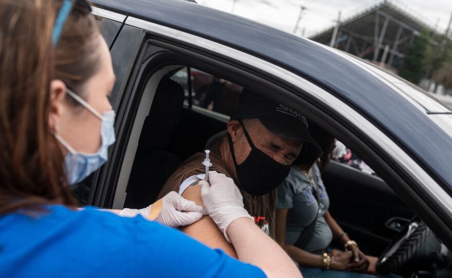 A nurse administers a COVID-19 vaccine in Ridgeway, Va., in March.