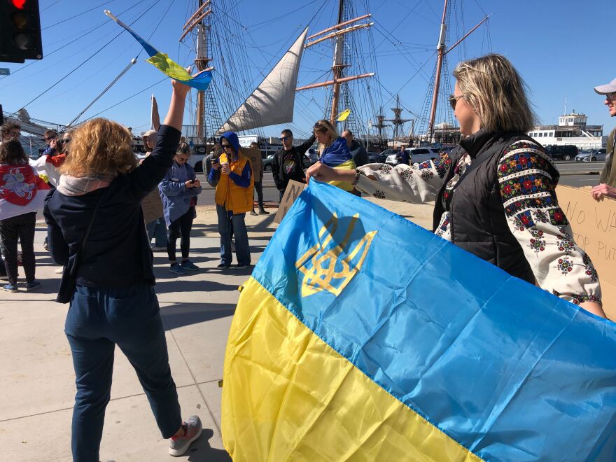 People gather next to the County Administration Building to show support for Ukraine on Feb. 24, 2022.