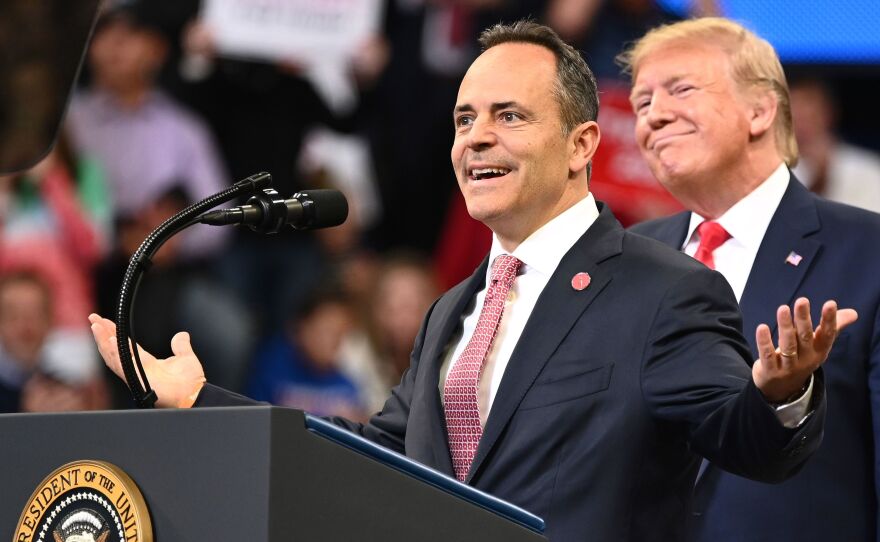 President Trump smiles behind Kentucky Gov. Matt Bevin during a rally at Rupp Arena in Lexington, Ky., on Nov. 4. Both Trump and Bevin have made unsubstantiated claims about election fraud.