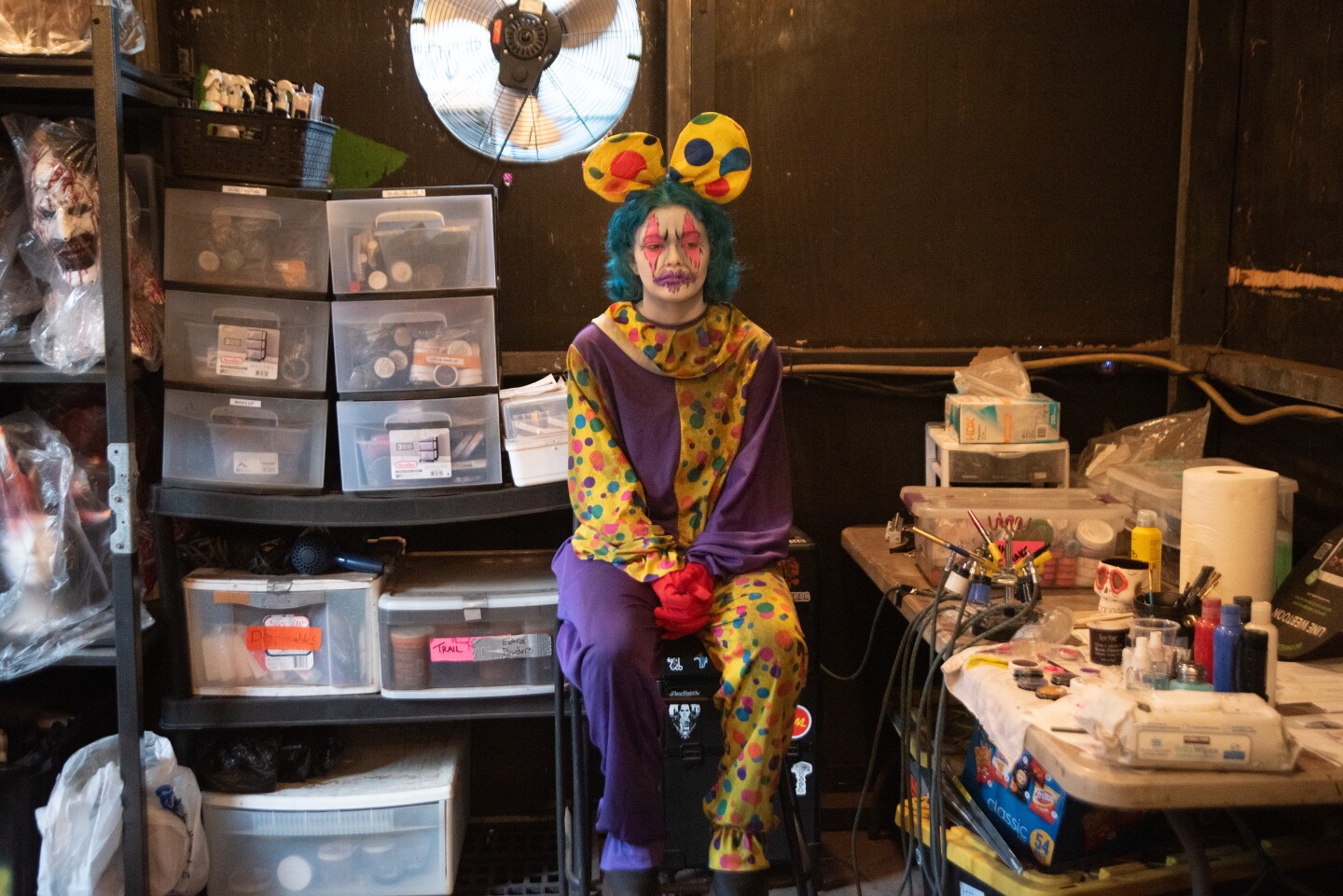 Scare actor Mau Abernathy is awaiting the final touches for her clown makeup at The Haunted Trail in Balboa Park on Sept. 25, 2025.