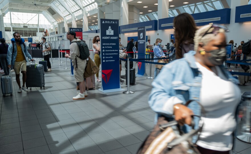 People travel through the terminal at John F. Kennedy Airport at the start of the Memorial Day weekend on May 27, 2022 in New York City. This coming Memorial Day is the start of a busy summer air travel season.