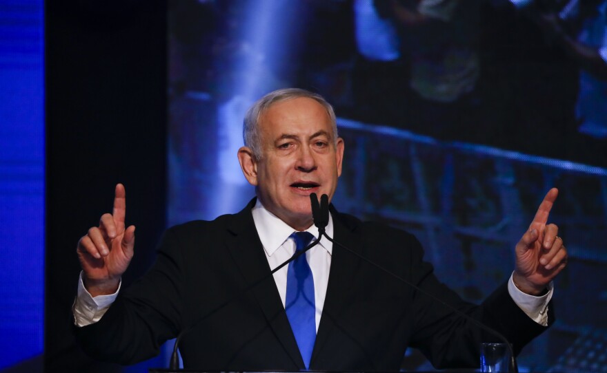 Israeli Prime Minister Benjamin Netanyahu addresses his supporters at party headquarters after elections in Tel Aviv, Israel, on Wednesday.