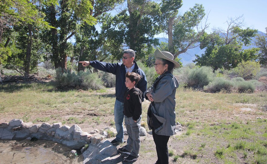 Three generations of the Yamamoto family return for the Manzanar Pilgrimage and visit the Arai Fish Pond, which was designed and built by Madelon Arai Yamamoto’s father, Jack Hanshiro Arai