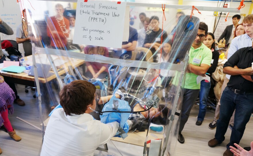 How do you a) isolate an Ebola patient and b) enable the caregiver to avoid infection? This team displays its design for an individual treatment unit.