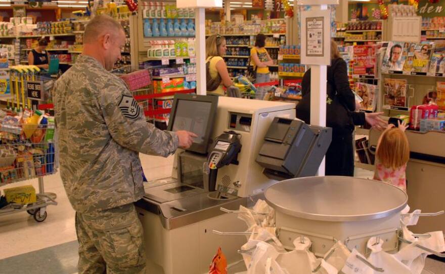 Service member shopping at a commissary.