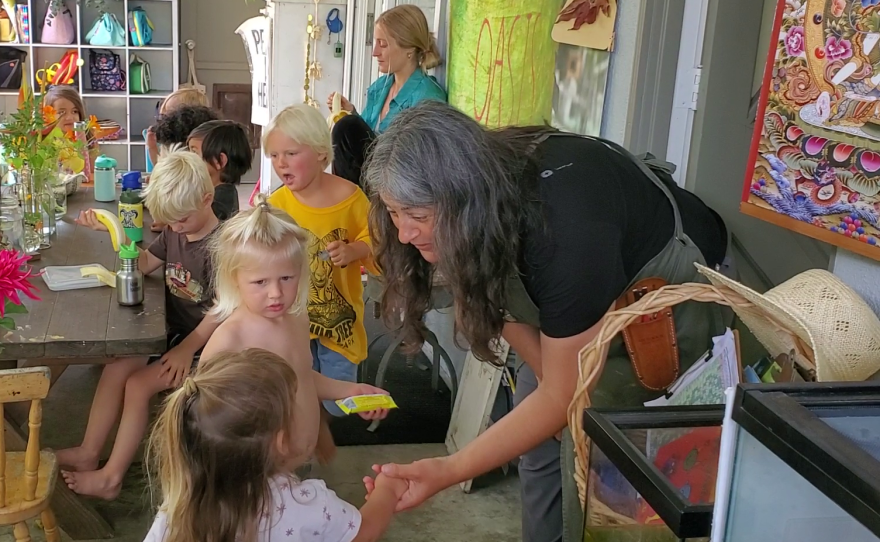 Liberty Winn works with kids at her childcare center in Carlsbad, May 18, 2022.