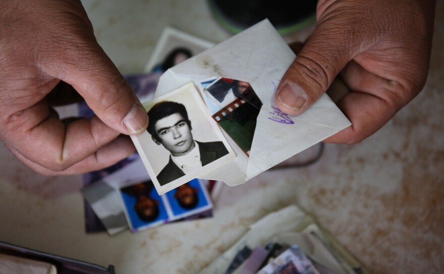 Uncollected or duplicate photographs found in boxes and drawers in backrooms of Kabul's photo studios.