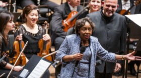Tania León speaks at the premiere of her piece "Stride," one of 19 pieces composed by women that the New York Philharmonic commissioned to celebrate the 100th anniversary of the 19th Amendment.