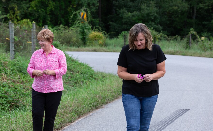 Ward (left) and Douthitt pick wildflowers down the road from their childhood home in Swannanoa, N.C.