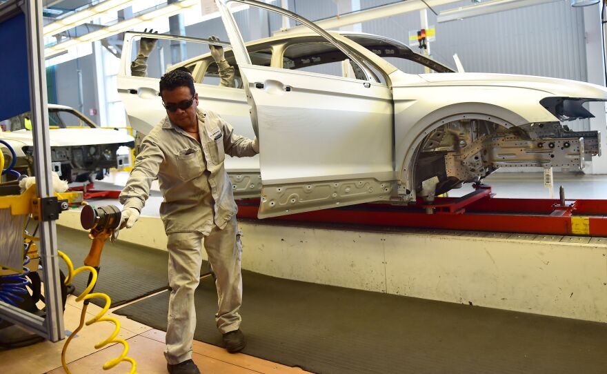 Employees work on the assembly line of the Tiguan model at the Volkswagen car plant in Puebla, central Mexico, in March. The auto sector is a key focus of the newly revised North American Free Trade Agreement.