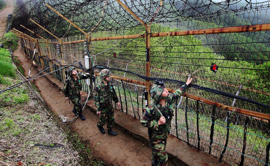 This year, South Korea and the United States have struggled with the question of how to respond to North Korea, which is accused of sinking a South Korean warship in March. Here, South Korean soldiers patrol the border with North Korea in May.