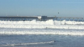 Waves crash against the Ocean Beach Pier, Dec. 8, 2015. 