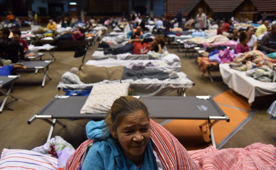 Puerto Ricans take refuge ahead of Hurricane Maria in the Clemente Coliseum in San Juan on Sept. 19.