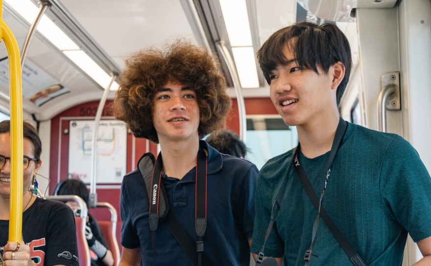 Michael Shaffer (left) rides the trolley with his cohort in this undated photo.
