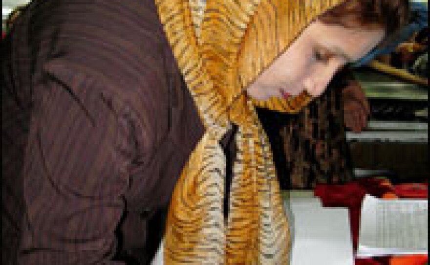 Hospital worker Mahbooba fills out a birth certificate for a newborn baby in Kabul.