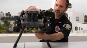 Oceanside police Lt. Michael Provence prepares the drone for launch, Aug. 26, 2025.