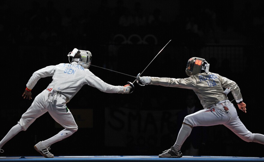Senegalese fencer Abdoulaye Thiam (left) competed against Jason Rogers of the U.S. during the 2008 Olympics. Due to Ebola fears, a World Cup fencing event set for Senegal this month has been canceled.