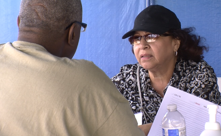 A veteran checks in at the counseling booth at the 27th annual Stand Down event July 18, 2014 to learn about the housing and health services he can access.
