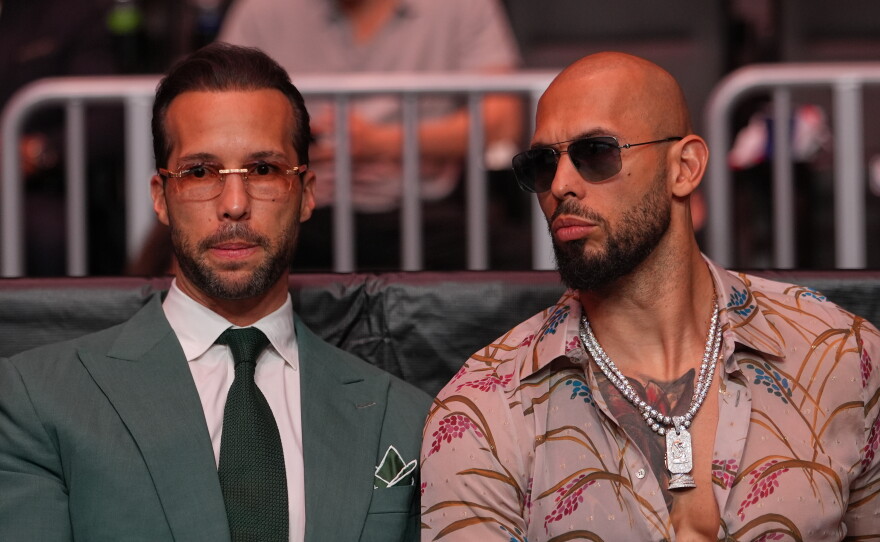 Andrew Tate, right, and his brother Tristan arrive an event, April 11, 2026, in Miami.