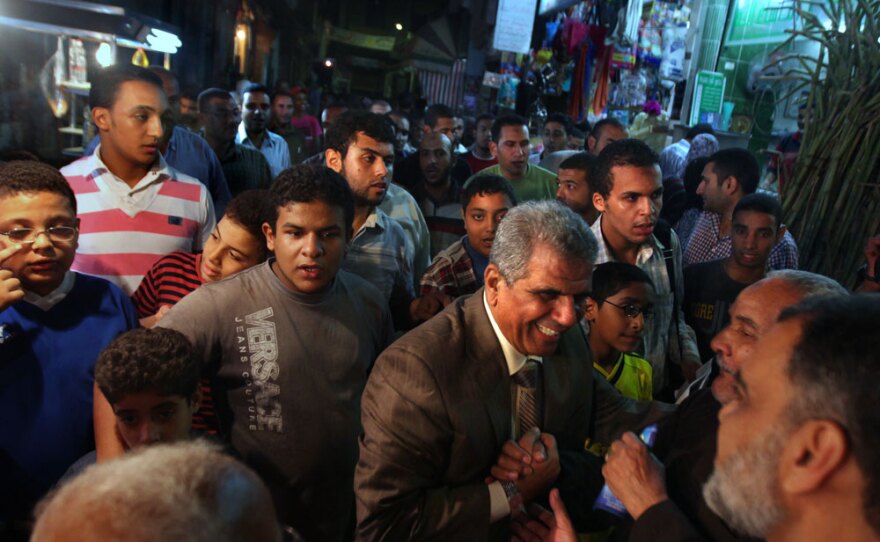 Parliament member Sobhy Saleh, an independent aligned with the Muslim Brotherhood, greets supporters in his neighborhood in Alexandria. The area strongly supports the Muslim Brotherhood, which is banned as a political movement in Egypt.