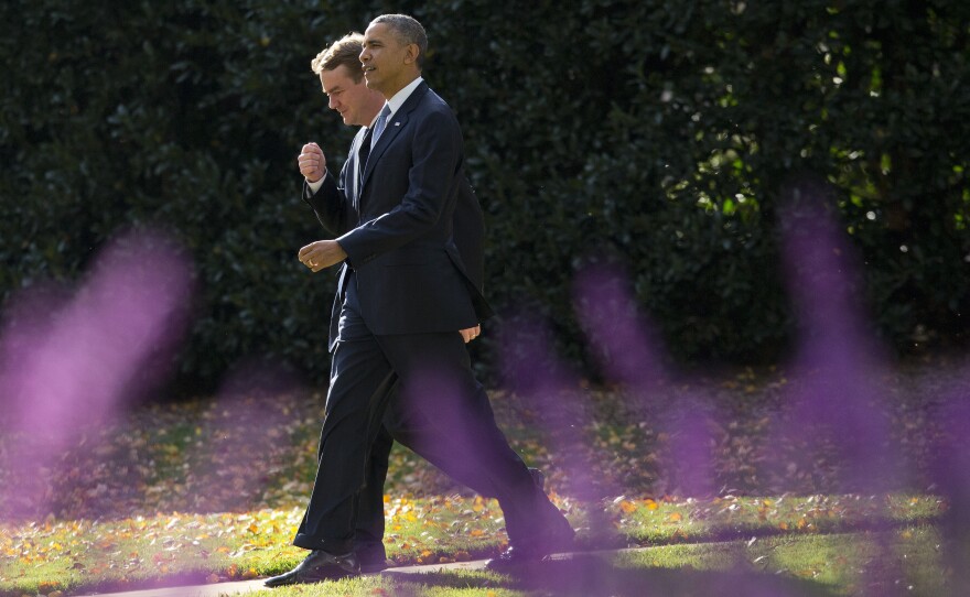 President Obama walks with the chairman of the Democratic Senatorial Campaign Committee, Colorado Sen. Michael Bennet, on the South Lawn of the White House on Wednesday.