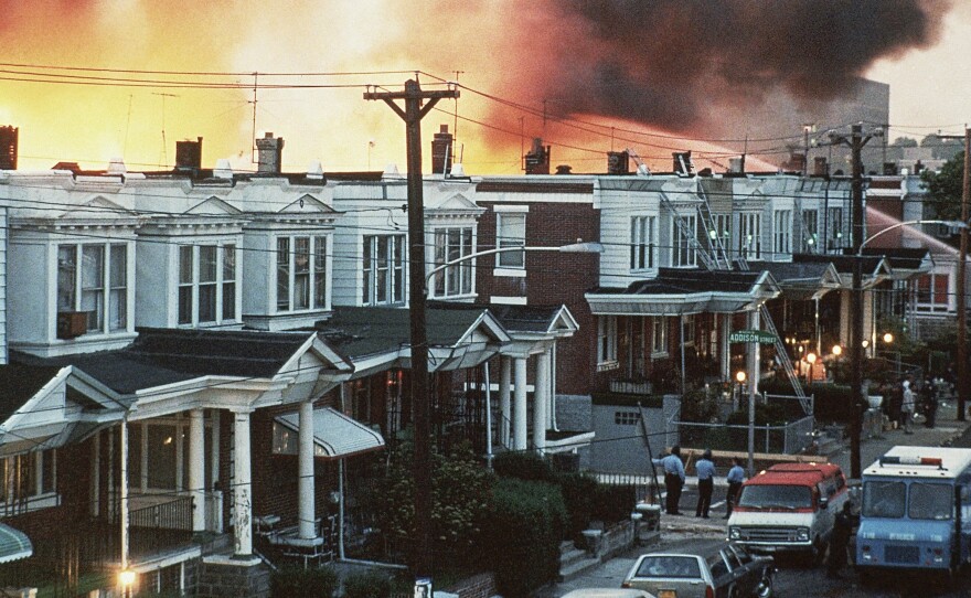 Flames shoot up skyward at the MOVE compound in West Philadelphia on May 13, 1985.
