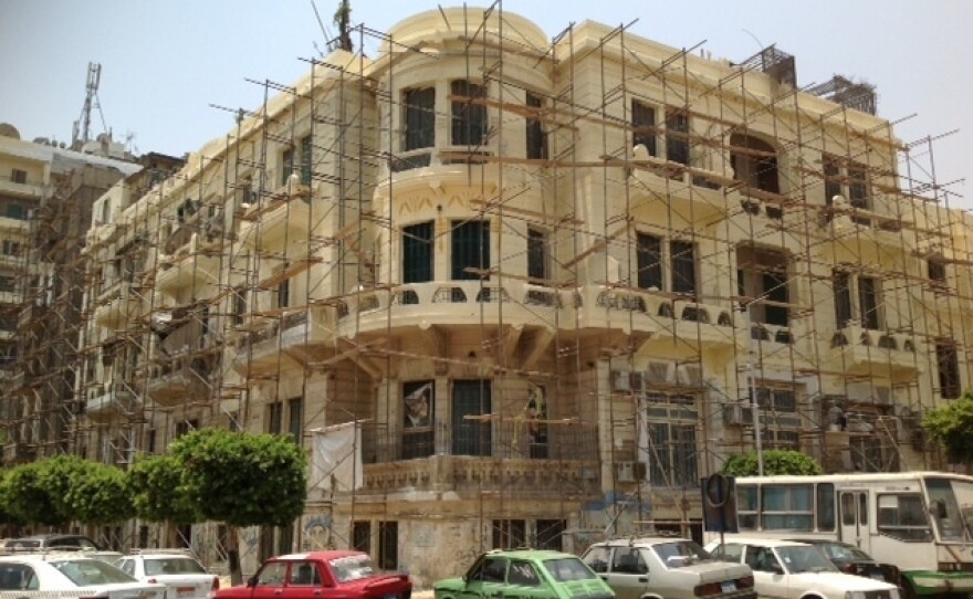 Cairo's ornate buildings, a mix of 19th century European and Middle Eastern architecture, are often lost in layers of dust and tacky storefronts.