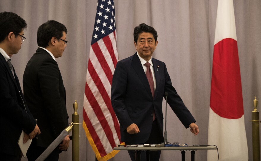 Prime Minister of Japan Shinzo Abe arrives to speak to reporters following a meeting with Donald Trump in November.