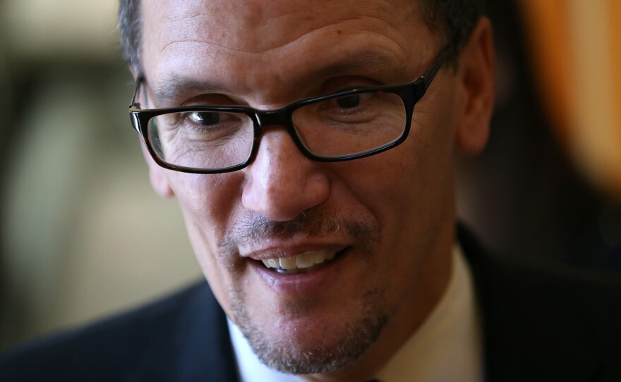 U.S. Labor Secretary Thomas Perez looks on while visiting La Cocina on January 22, 2014 in San Francisco.