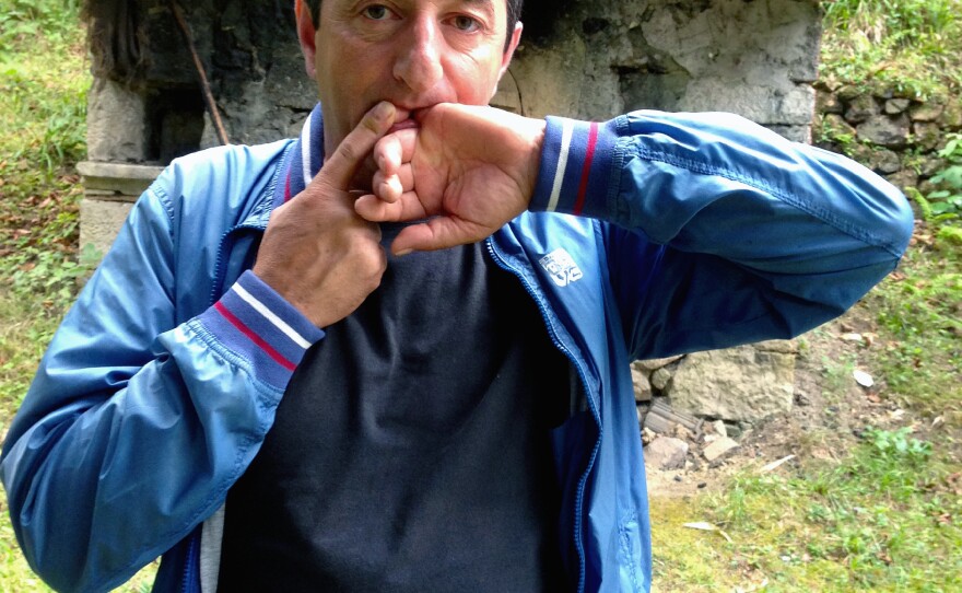 Halil Cindik, head of the Kuskoy Bird Language Association, demonstrates his technique for whistling Turkish words and phrases. The piercing tones can be heard a mile or more away, depending on conditions. Cindik says an annual festival is helping to keep the whistled language alive, but the spread of cellphones is causing villagers to abandon it.