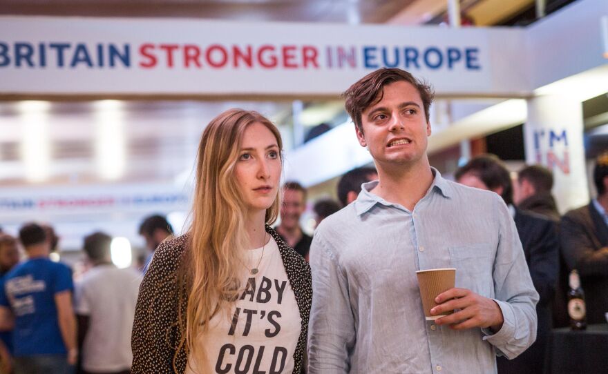 Supporters of the "Stronger In"Campaign react as results of the EU referendum are announced at a results party at the Royal Festival Hall in London early Friday morning.