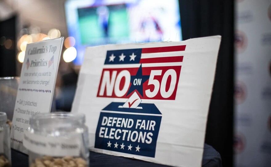 A “No on Prop 50” sign at the Kern County Republican Party booth at the Kern County Fair in Bakersfield on Sept. 26, 2025. 