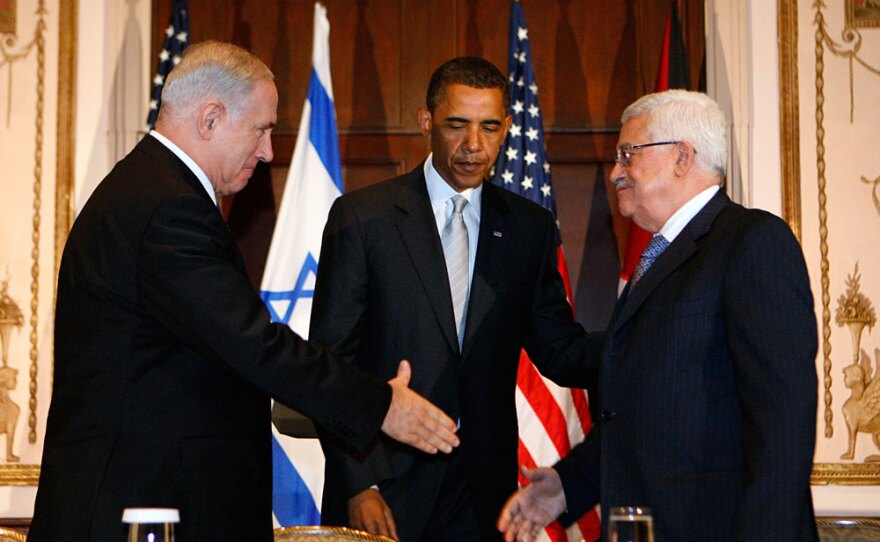 President Obama watches as Israeli Prime Minister Benjamin Netanyahu and Palestinian President Mahmoud Abbas shake hands last September in New York. Current tensions have laid bare problems between longtime allies U.S. and Israel and the cloudy prospects for peace.