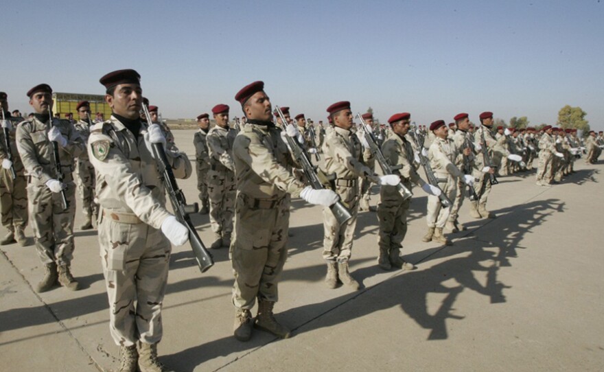 Iraqi soldiers take part in a graduation parade in Kirkuk on Monday. The oil-rich city is a mix of Kurds, Arabs, Turkmen and others. Its future status is a source of tension within Iraq.