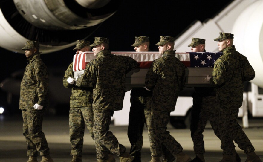 Marines carry the remains of Cpl. Derek Wyatt upon arrival at Dover Air Force Base, Del., on Dec. 8, 2010. He was killed by hostile fire during a deployment to Sangin in southern Afghanistan's Helmand province.