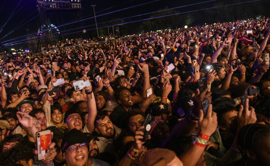 The crowd watches as Travis Scott performs at the Astroworld Festival at NRG park on Friday, in Houston.