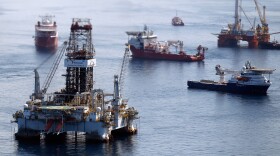 Ships work near the site of the BP Deepwater Horizon oil spill on August 3, 2010 in the Gulf of Mexico off the coast of Louisiana.