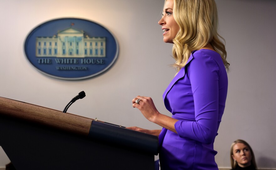 Leavitt sits to the right side of then White House Press Secretary Kayleigh McEnany as she holds a briefing at the James Brady Press Briefing Room of the White House.