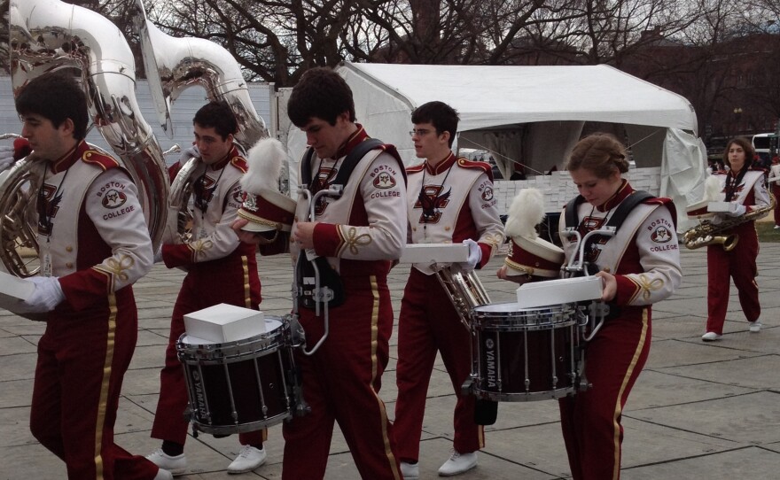 The Boston College marching band tunes up prior to performing along the National Mall.