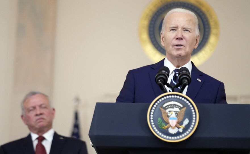 President Biden speaks with Jordan's King Abdullah II in the Cross Hall of the White House on Feb. 12 in Washington.