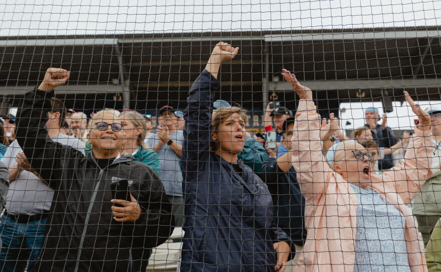 Fans behind home plate during opening day ceremonies on Saturday, Aug. 1.