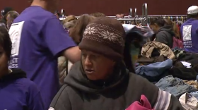 People pick out clothing donations at Project Homeless Connect in January 2013.
