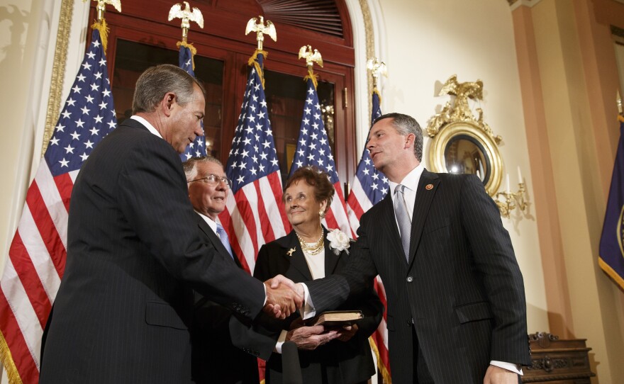 Newly elected GOP Congressman David Jolly of Florida, right, poses for a ceremonial swearing-in with Speaker of the House John Boehner, R-Ohio, on March 13. Jolly edged out Democrat Alex Sink in a special election that Republicans cast as a referendum on President Obama and his unpopular health care law.