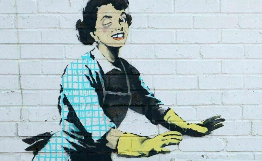 <em>Valentine's Mascara</em> by street artist Banksy, on the side of a house in Margate, England.