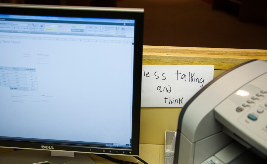 Keleher leaves a reminder note on his desk at the Institute for Community Inclusion, where he works.