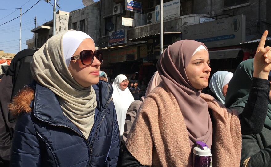 Zina Khabbas (left), a Jordanian engineering graduate who says she wants to leave the country but has no interest in going to the United States. Khabbas was at a demonstration Friday protesting rising prices of fuel and government services.